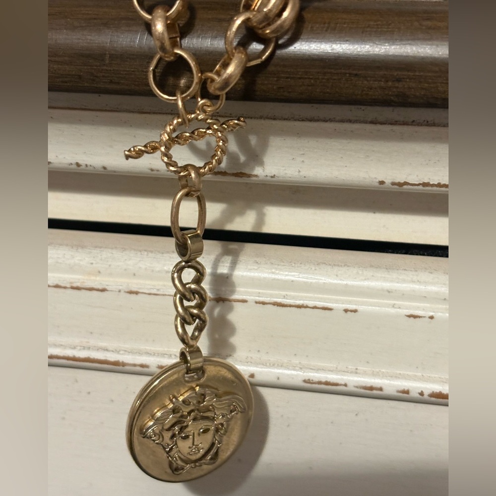 Versace large pendant genuine made in Italy -added non Versace chain.